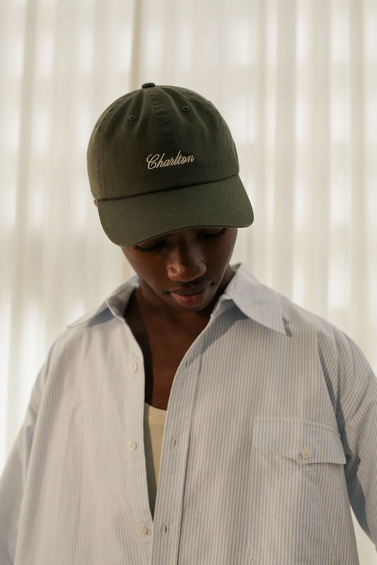 'A Simple Twist Of Fate' British Racing Green Cap by