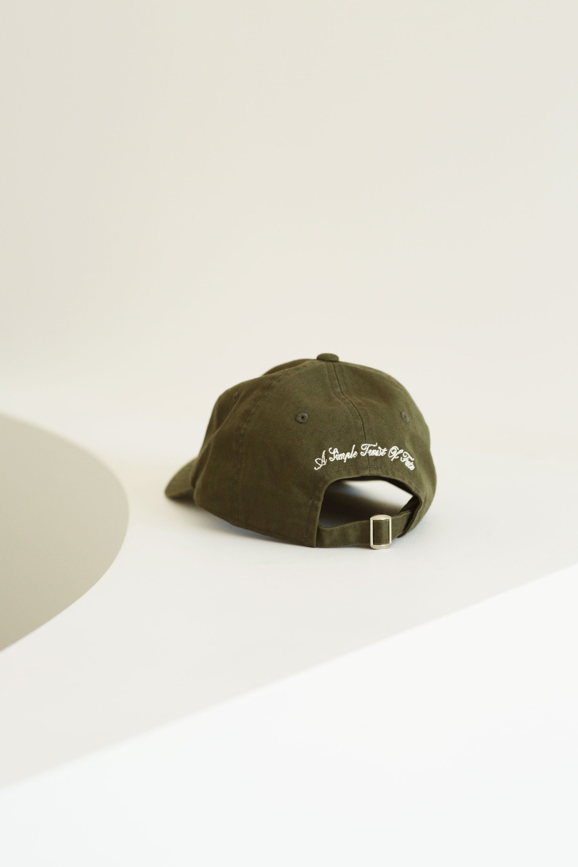 'A Simple Twist Of Fate' British Racing Green Cap